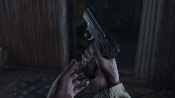 Loading a gun in first person, Resident Evil Village
