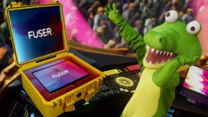 An image from Fuser showing off someone in a crocodile costume on stage with a custom Fuser branded laptop to the side of them